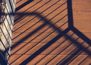 Photo of sunshine to the balcony and reflection the shadow on wo